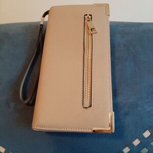 Elegant Beige Wristlet with Gold Accents